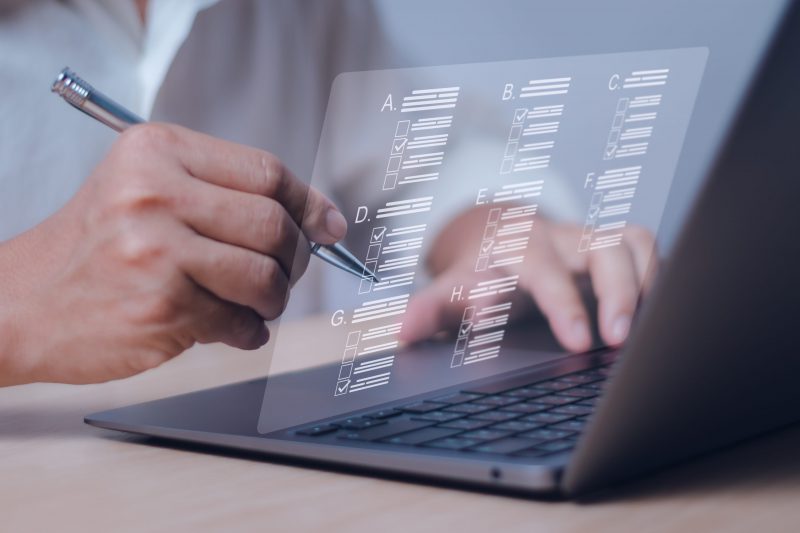 A young Black woman leads her team in a project meeting