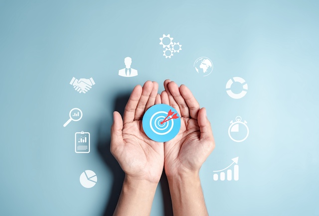 A young Black woman leads her team in a project meeting