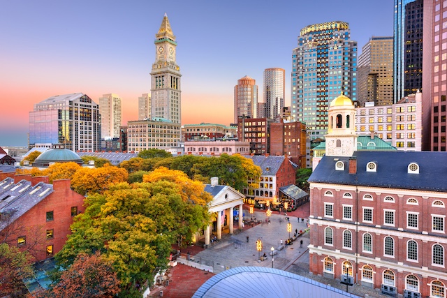 Boston, MA skyline with Faneuil Hall and Quincy Market at dusk