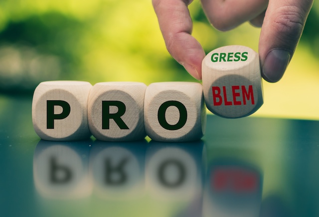 A young Black woman leads her team in a project meeting