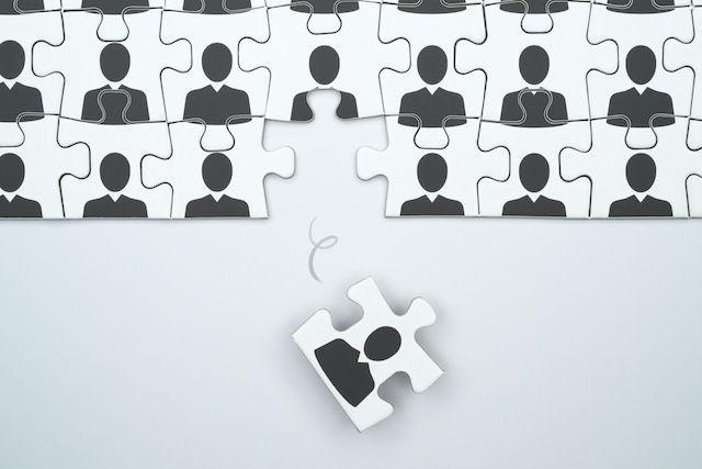 A young Black woman leads her team in a project meeting