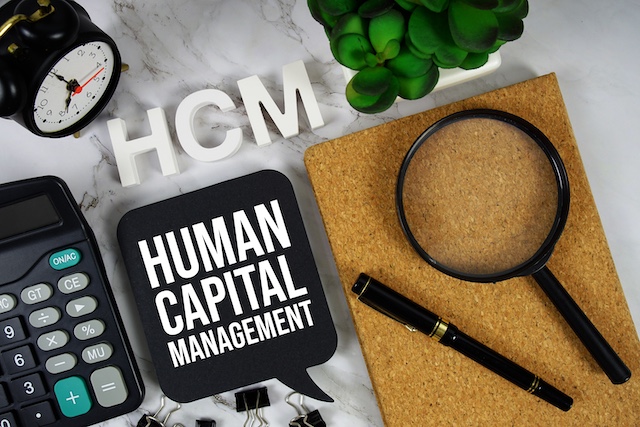 A young Black woman leads her team in a project meeting