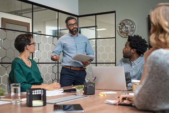 A management team meets to discuss serious matters 